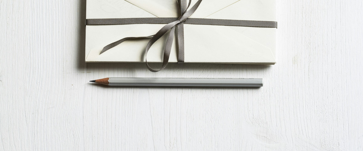 White Envelope on a wooden desk